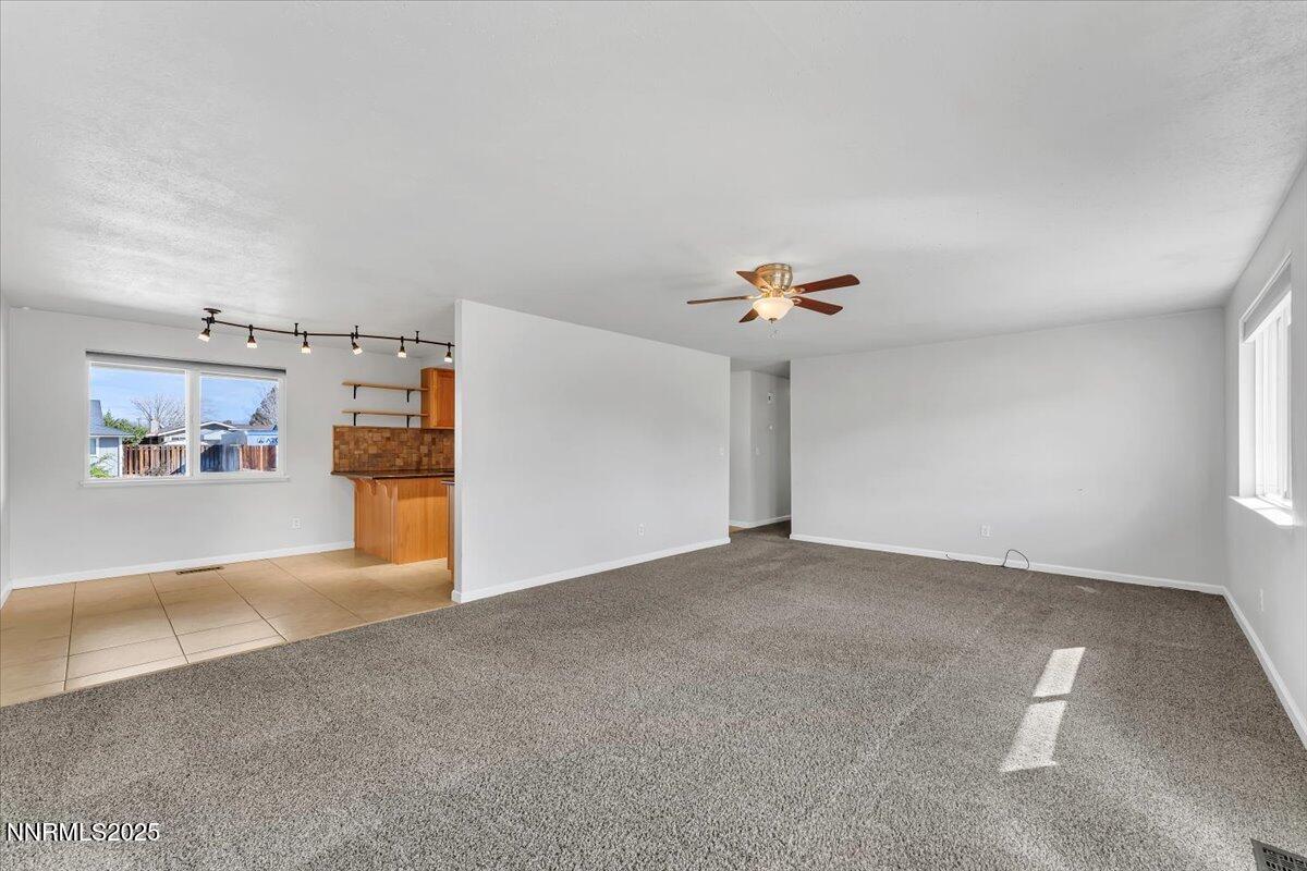 1275 Bolivia Way Gardnerville, NV 89460 - Photo 9 of 59 a view of a livingroom with a ceiling fan and window