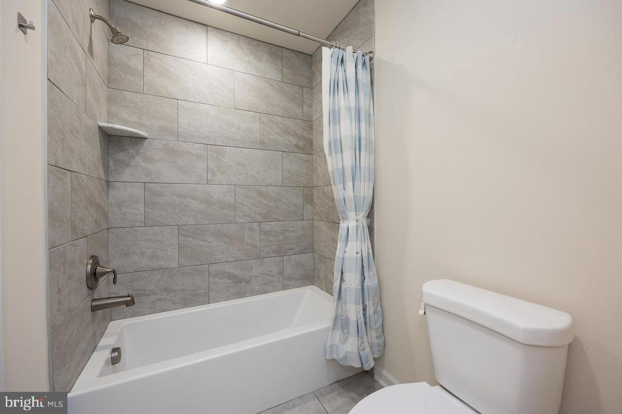 427 Lee Place Exton, PA 19341 - Photo 27 of 33 Modern bathroom with sleek tile design.