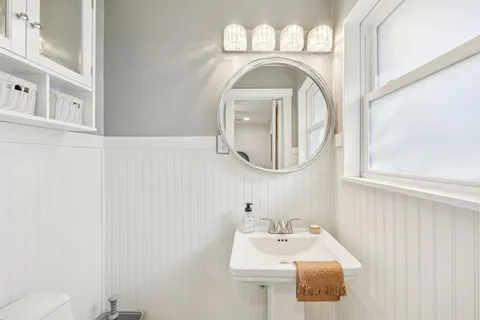 a bathroom with a sink and a mirror