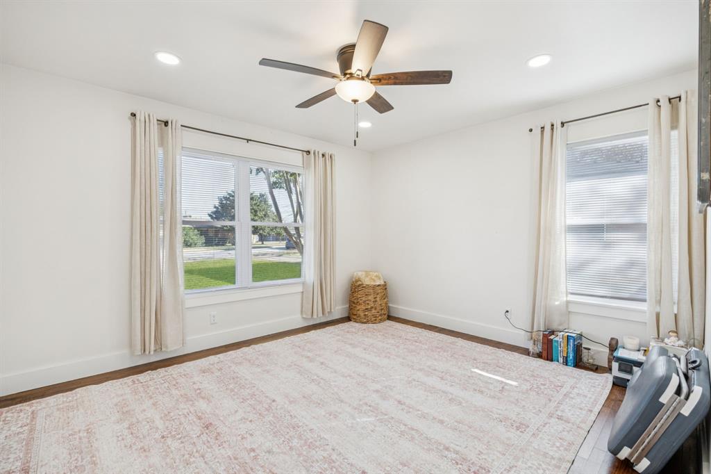 207 Joe White Street Rockwall, TX 75087 - Photo 14 of 27 a view of a livingroom with a ceiling fan and window