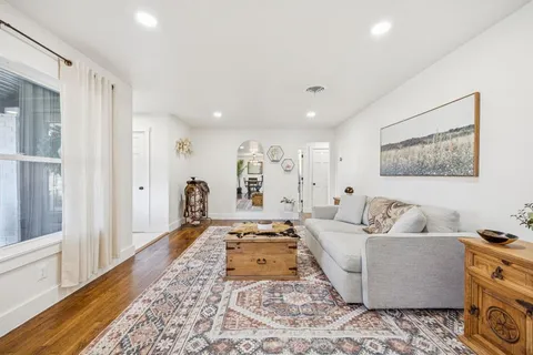 a living room with furniture and a rug