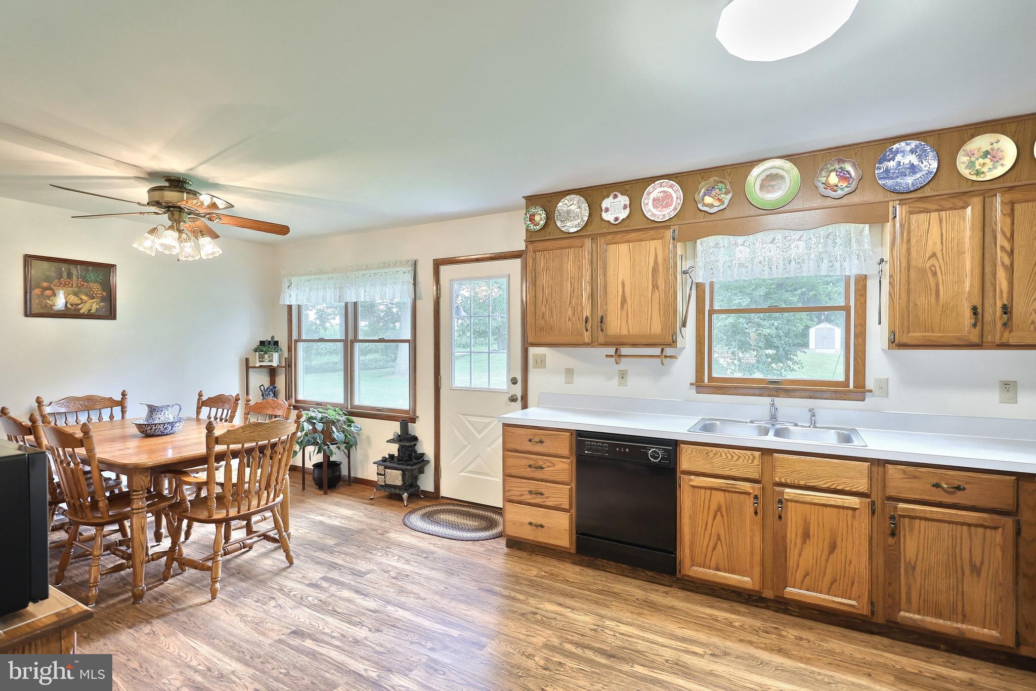 785 Gebhart Road Windsor, PA 17366 - Photo 23 of 45 a open kitchen with stainless steel appliances granite countertop a stove and a wooden floors