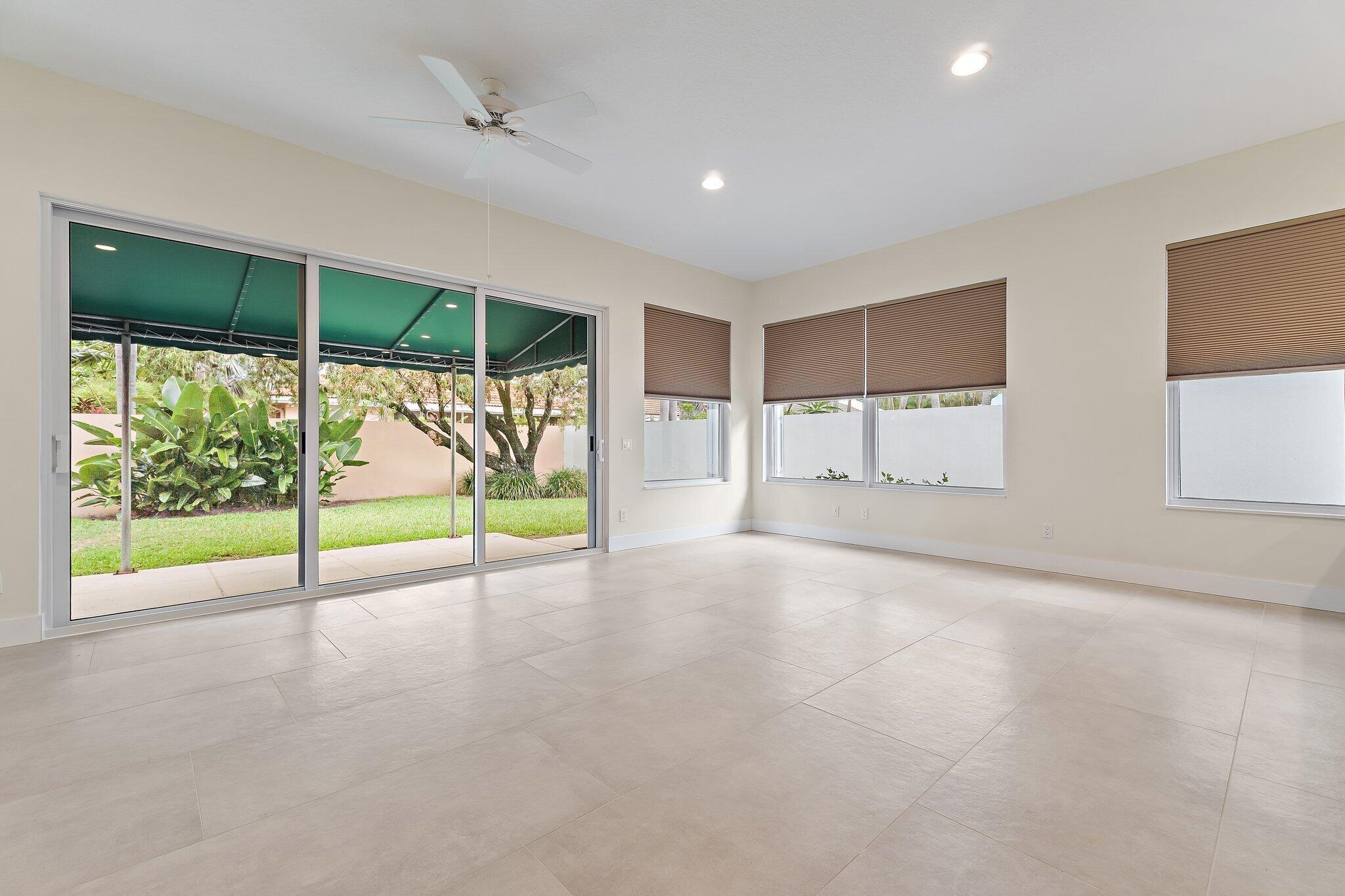 173 East Hampton Way Jupiter, FL 33458 - Photo 14 of 28 a view of an empty room with a sliding door