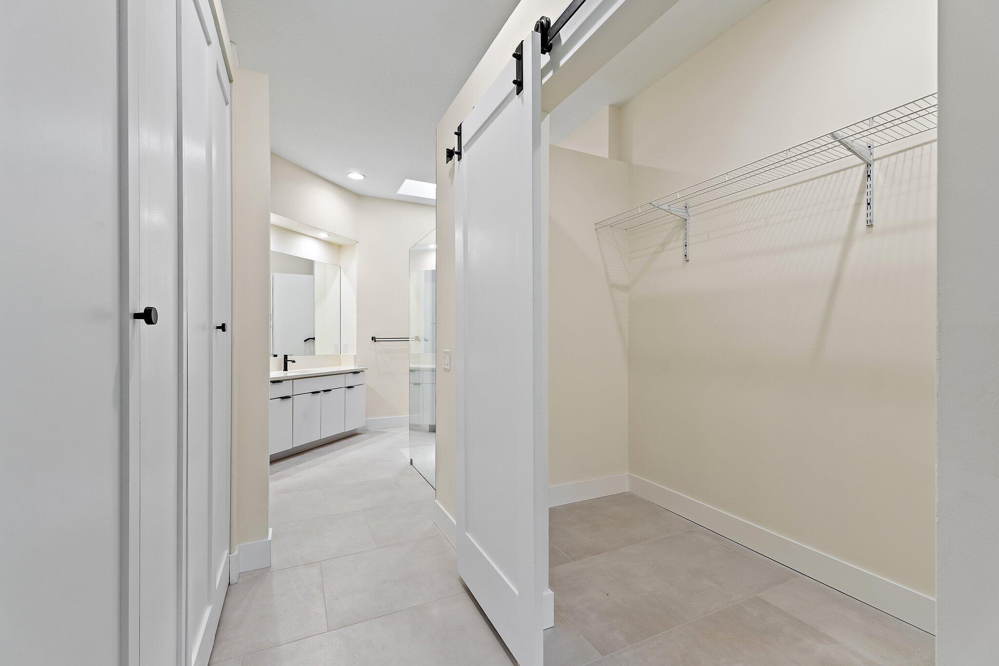 173 East Hampton Way Jupiter, FL 33458 - Photo 17 of 28 a bathroom with a sink and a mirror