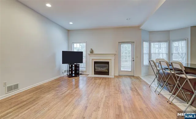 a view of a livingroom with furniture and a fireplace