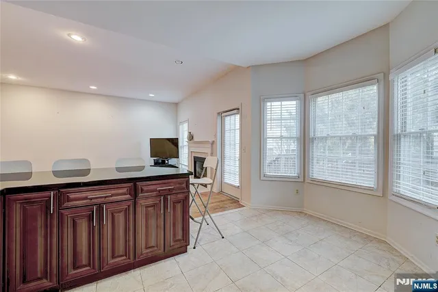a kitchen with a sink and wooden cabinets