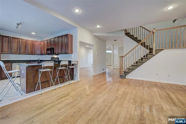 a view of kitchen with sink microwave and stove