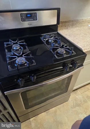 a close up of a stove top oven sitting inside of a kitchen