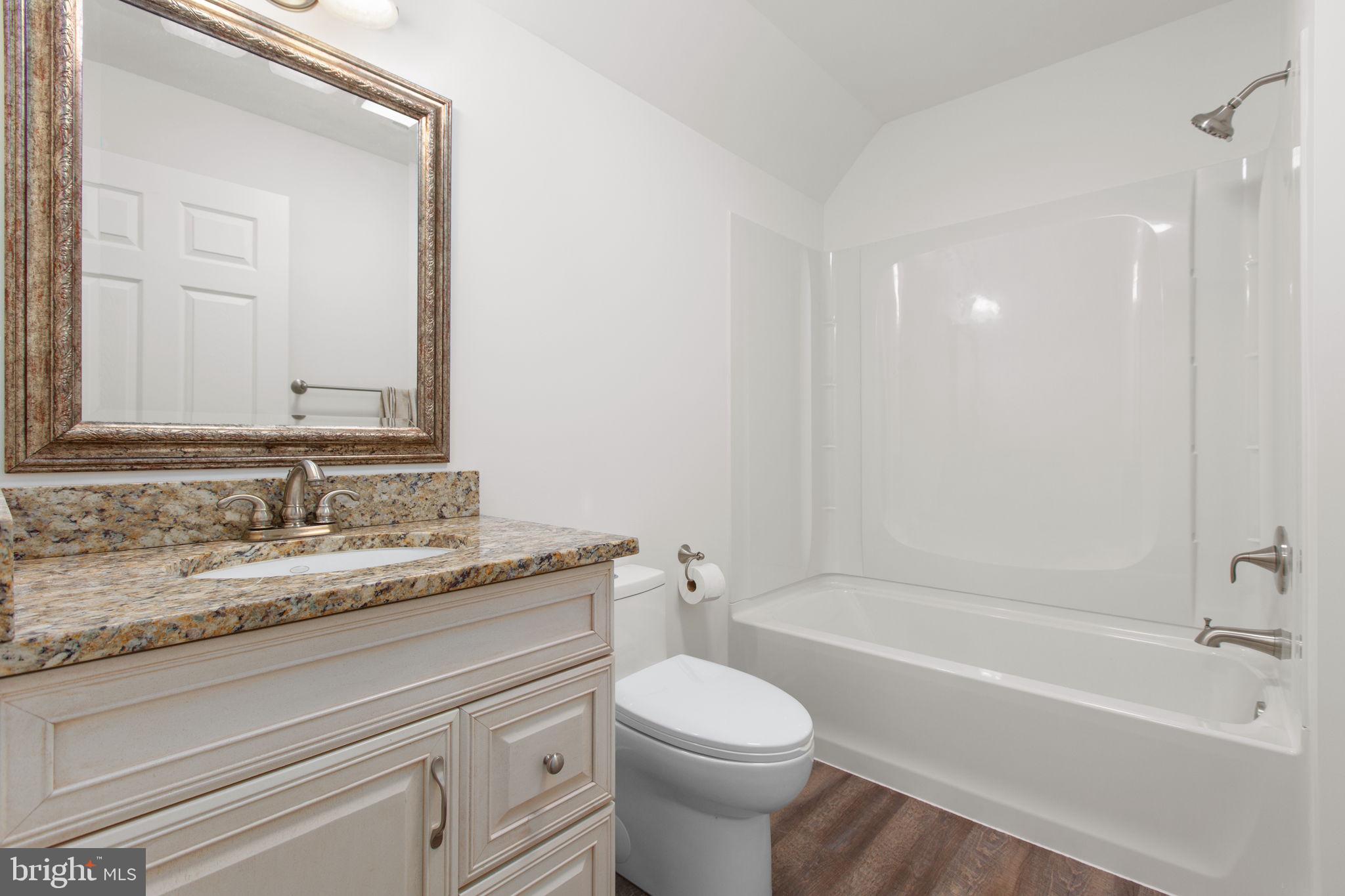 8401 Seays Road Spotsylvania, VA 22551 - Photo 26 of 32 Full bathroom #2 with tub/shower and LVP flooring