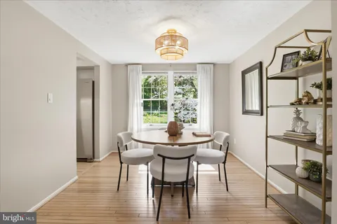 a view of a dining room with furniture and a livingroom