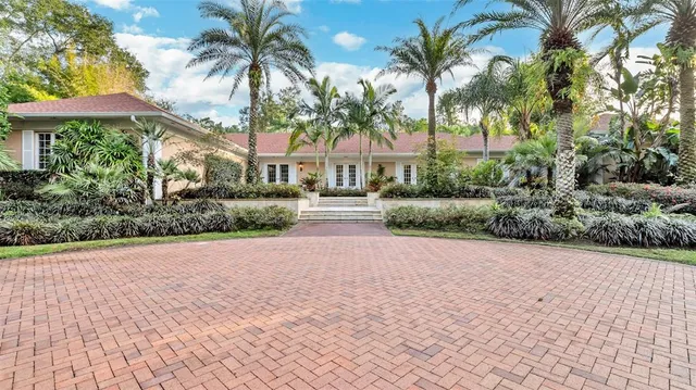 a view of a garden with a house