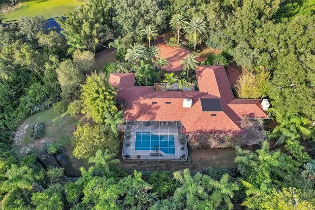 a view of a house with a yard and sitting area