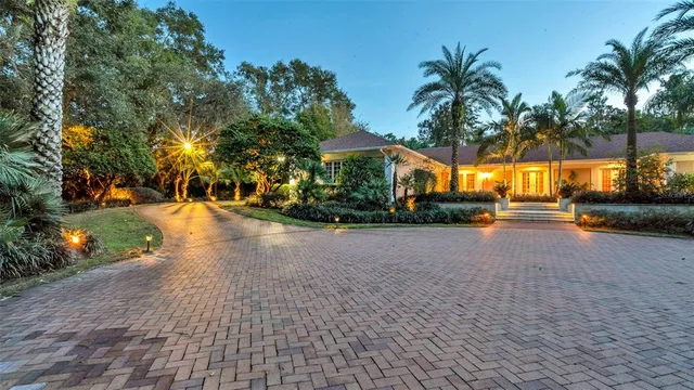 a living room with furniture fireplace and window