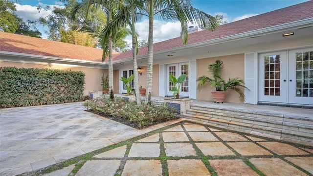 a view of a dining room with furniture wooden floor and chandelier