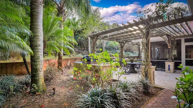 a view of a dining room with furniture a chandelier and wooden floor
