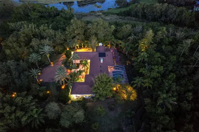 a view of a dining table and chairs in the patio