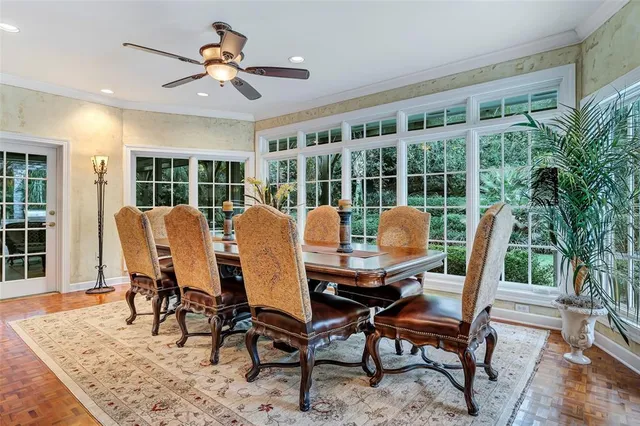 a spacious bedroom with a bed and a wooden floor