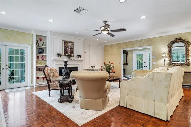 a living room with furniture and a floor to ceiling window