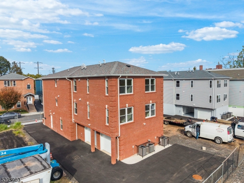 24 Garibaldi Avenue Newark, NJ 07114 - Photo 3 of 13 a view of a house with backyard and sitting area