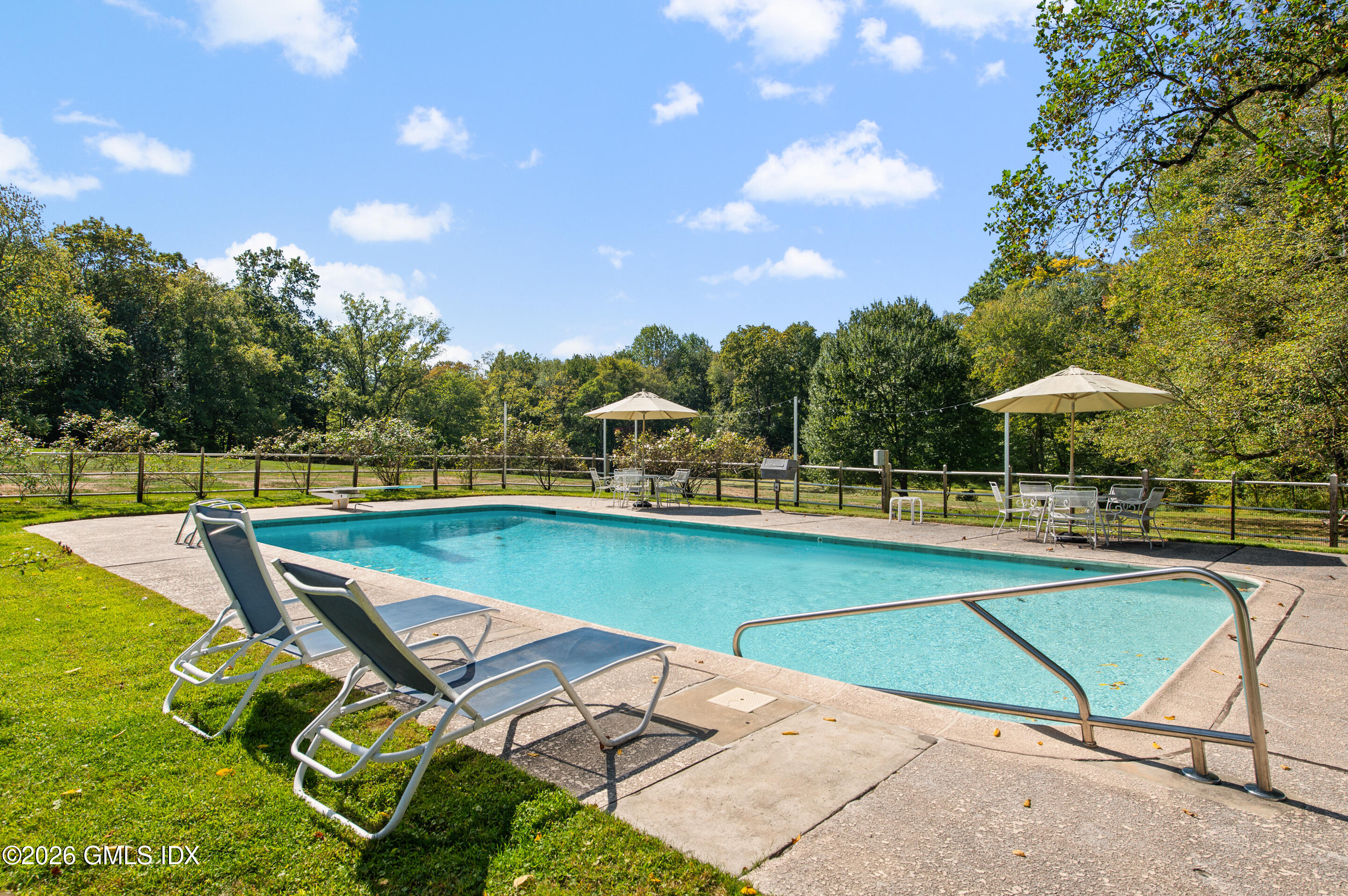 122 Round Hill Road Greenwich, CT 06831 - Photo 19 of 37 a view of a swimming pool with lounge chairs