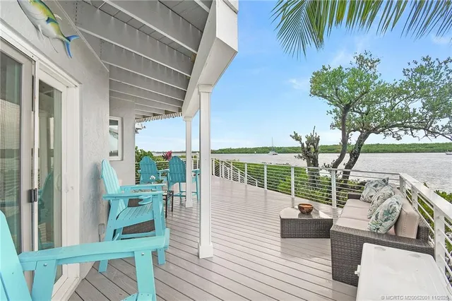 a kitchen with a refrigerator and potted plant