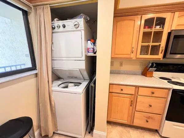 a kitchen with a sink and a microwave