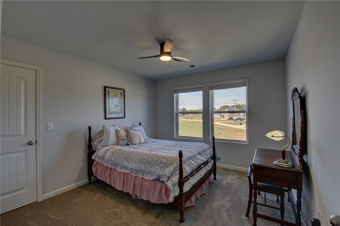 220 Clinkscales Road Anderson, SC 29624 - Photo 17 of 33 Plentiful natural light streams through double windows in this cozy carpeted bedroom.