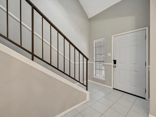 a view of an entryway with stairs