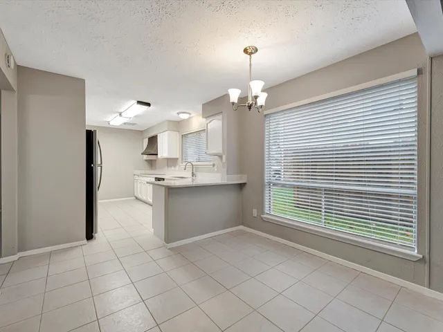 a view of kitchen and windows