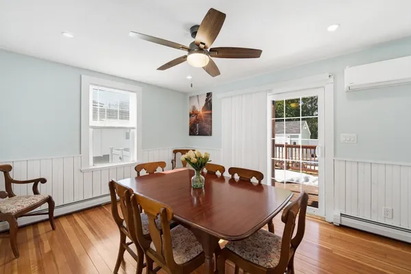 a view of a dining room with furniture window and wooden floor