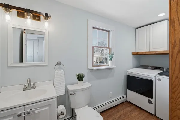 a bathroom with a sink toilet and vanity