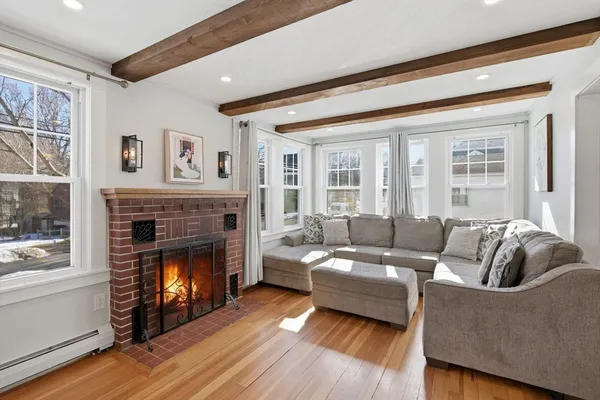 a living room with furniture and a fireplace