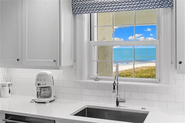 a kitchen with a sink and cabinets