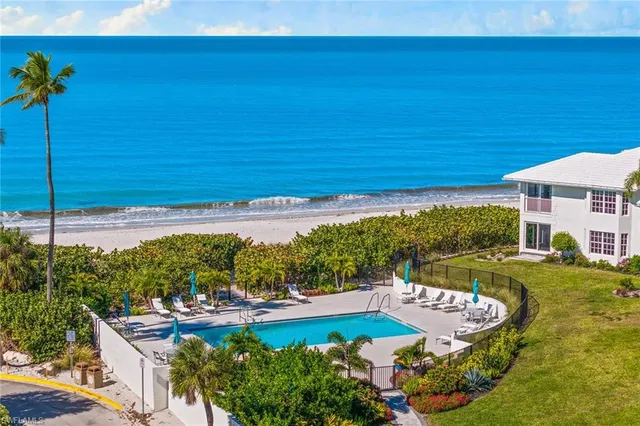 a view of a swimming pool with a yard
