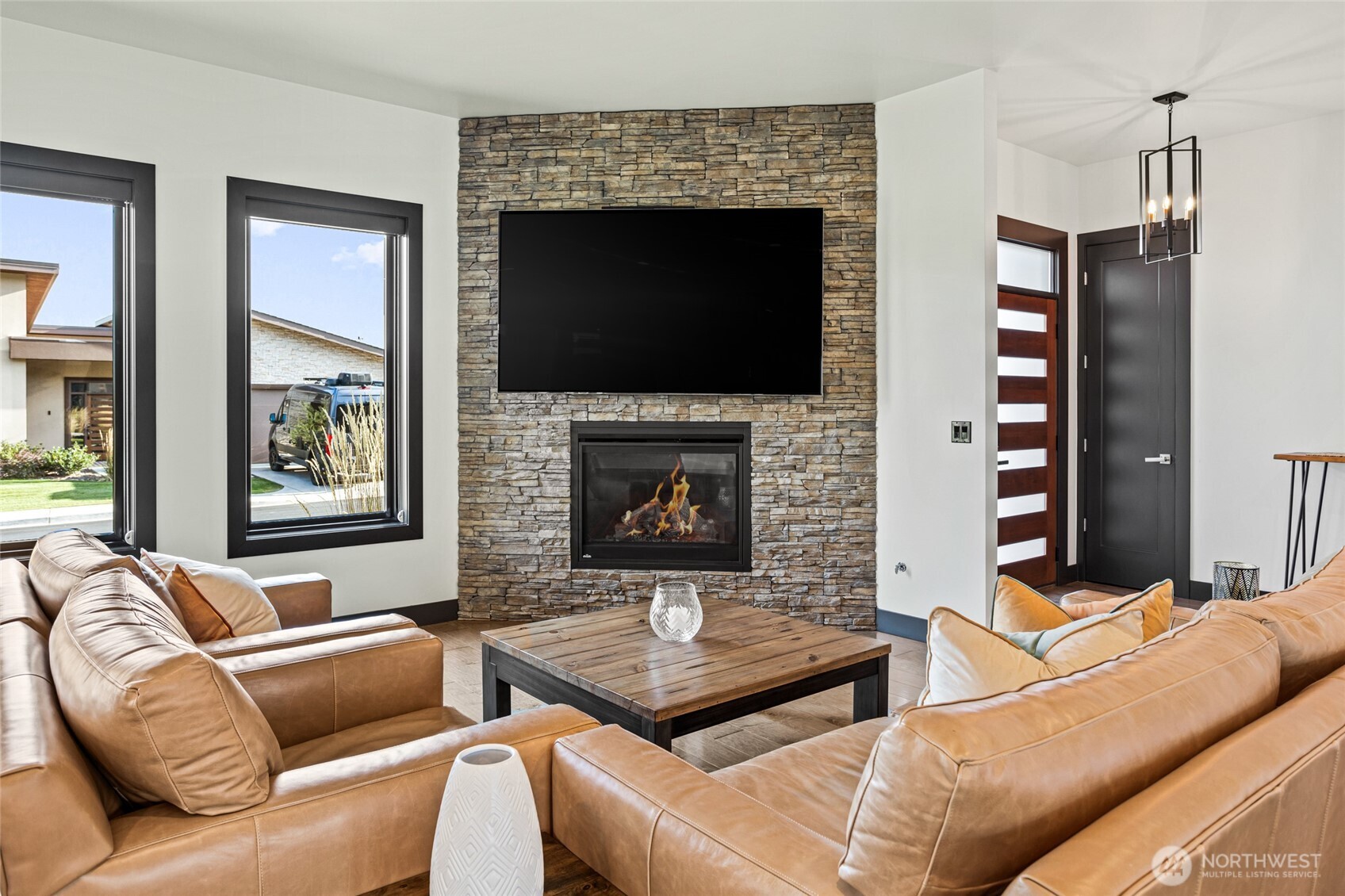 4305 Catalyss Way Yakima, WA 98908 - Photo 17 of 35 a living room with furniture fireplace and flat screen tv
