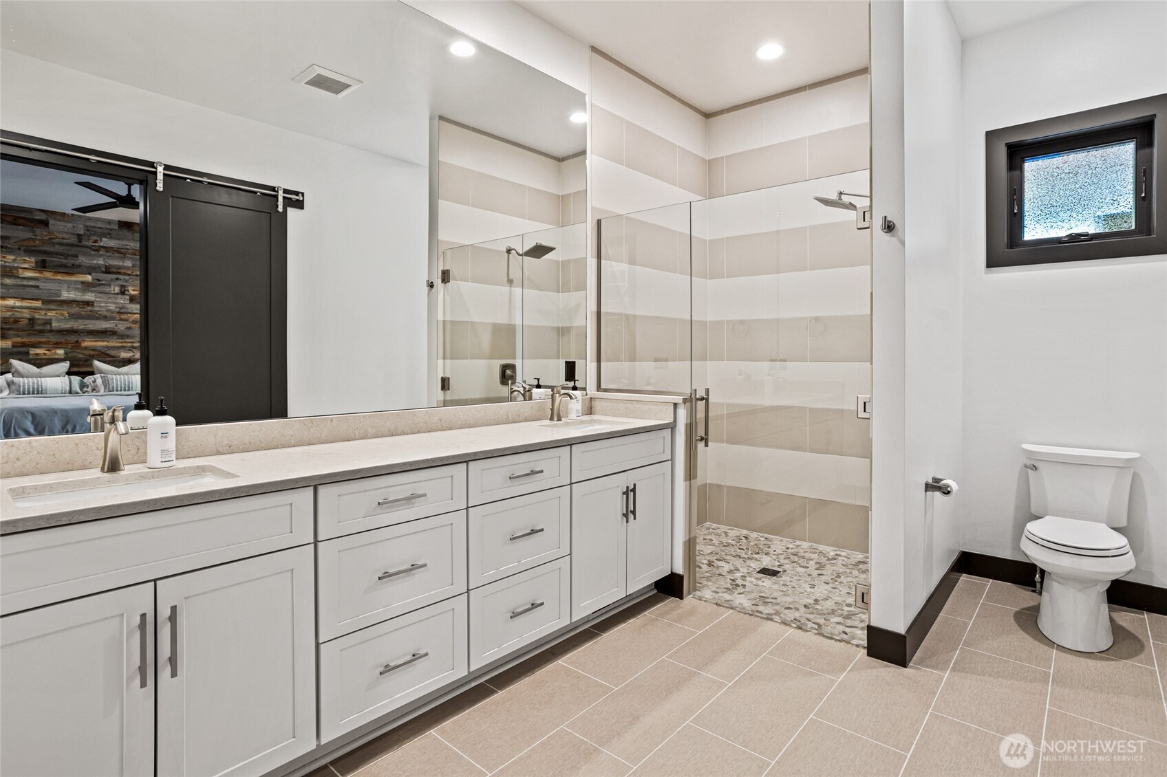 4305 Catalyss Way Yakima, WA 98908 - Photo 23 of 35 a bathroom with a double vanity sink toilet and shower