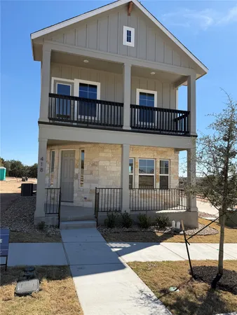 a view of front of a house with a balcony