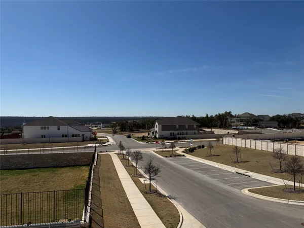 a view of a swimming pool with outdoor seating