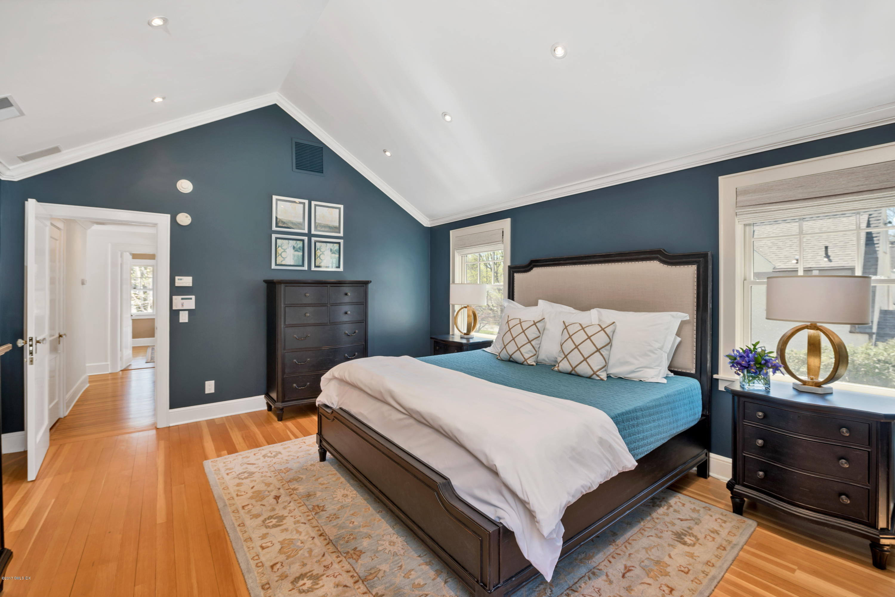 76 Valleywood Road Cos Cob, CT 06830 - Photo 12 of 24 a bedroom with a bed and ceiling fan