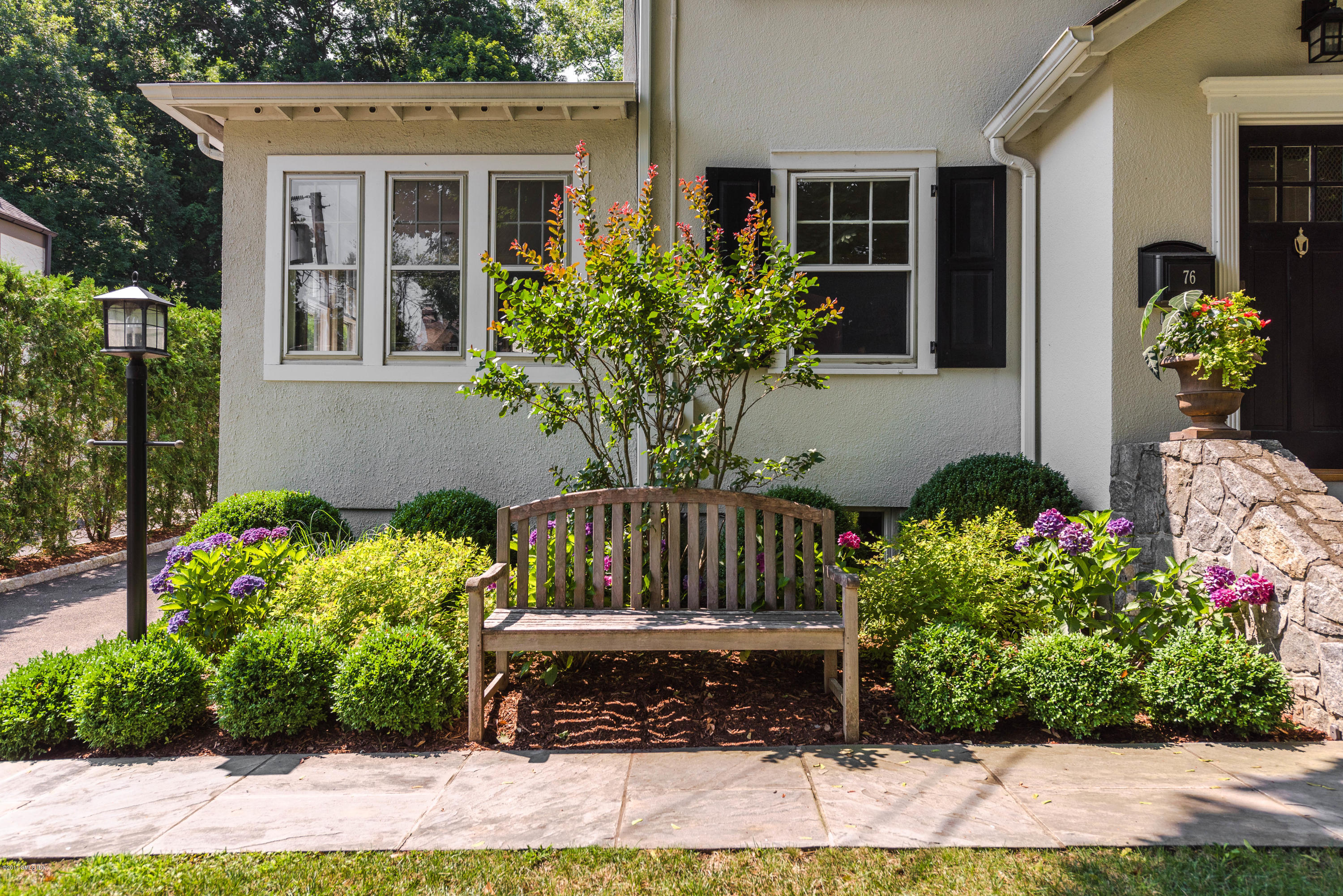 76 Valleywood Road Cos Cob, CT 06830 - Photo 2 of 24 a view of a chairs and table in the backyard