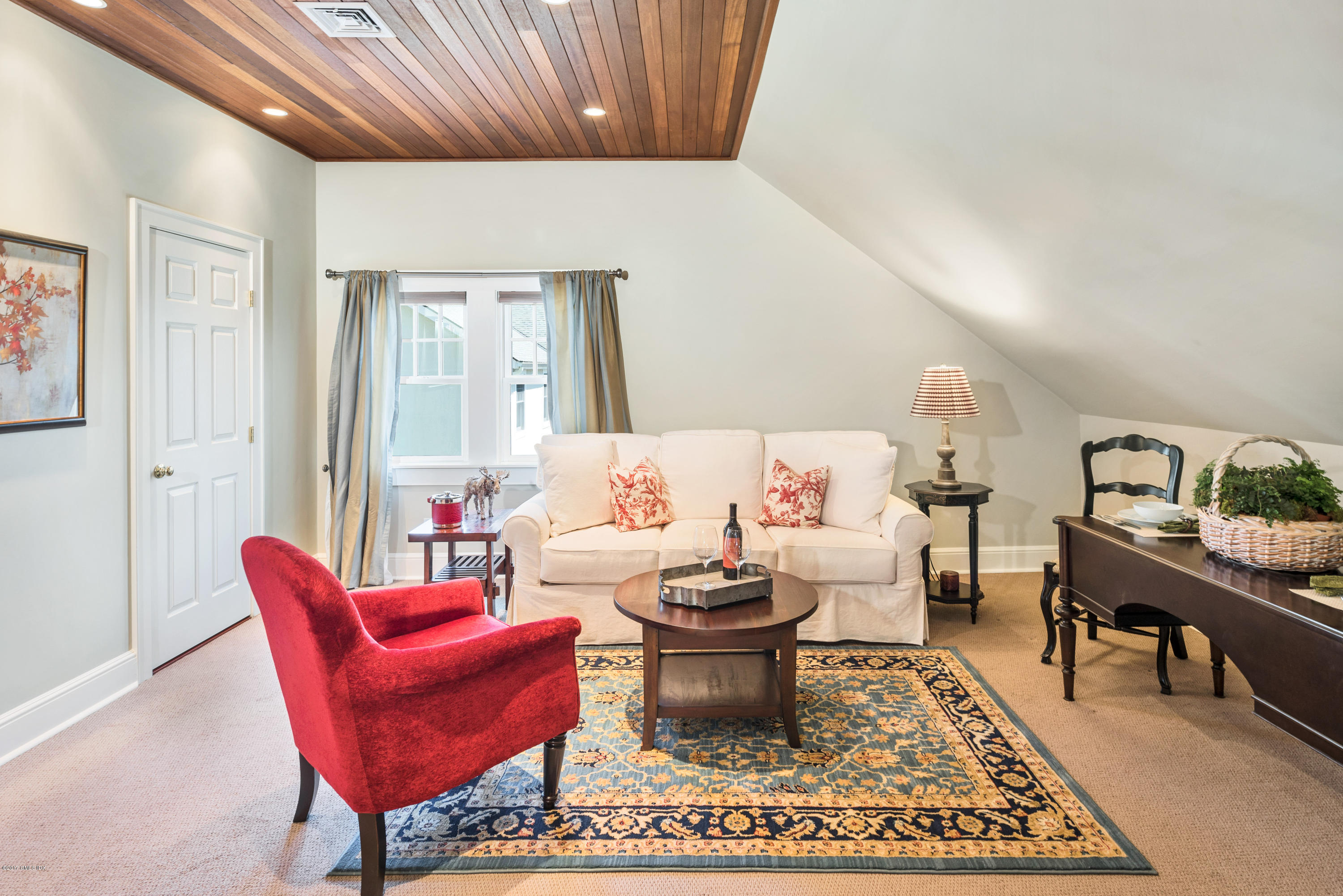 76 Valleywood Road Cos Cob, CT 06830 - Photo 21 of 24 a living room with furniture a rug and a table