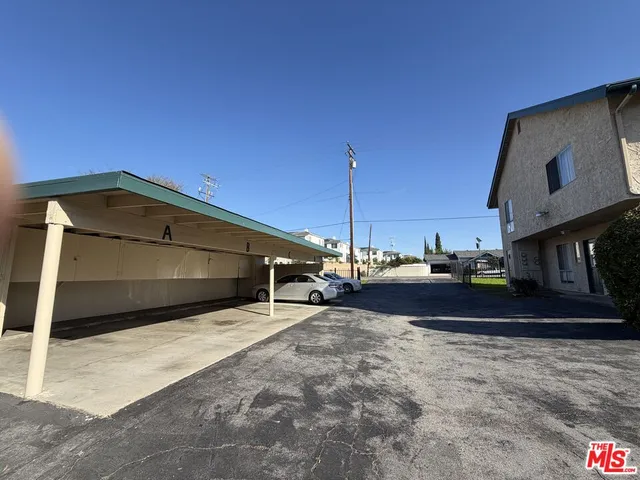 a view of a car park in front of house