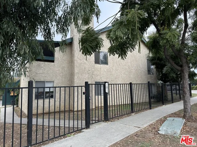 a view of a wrought iron fences in front of house