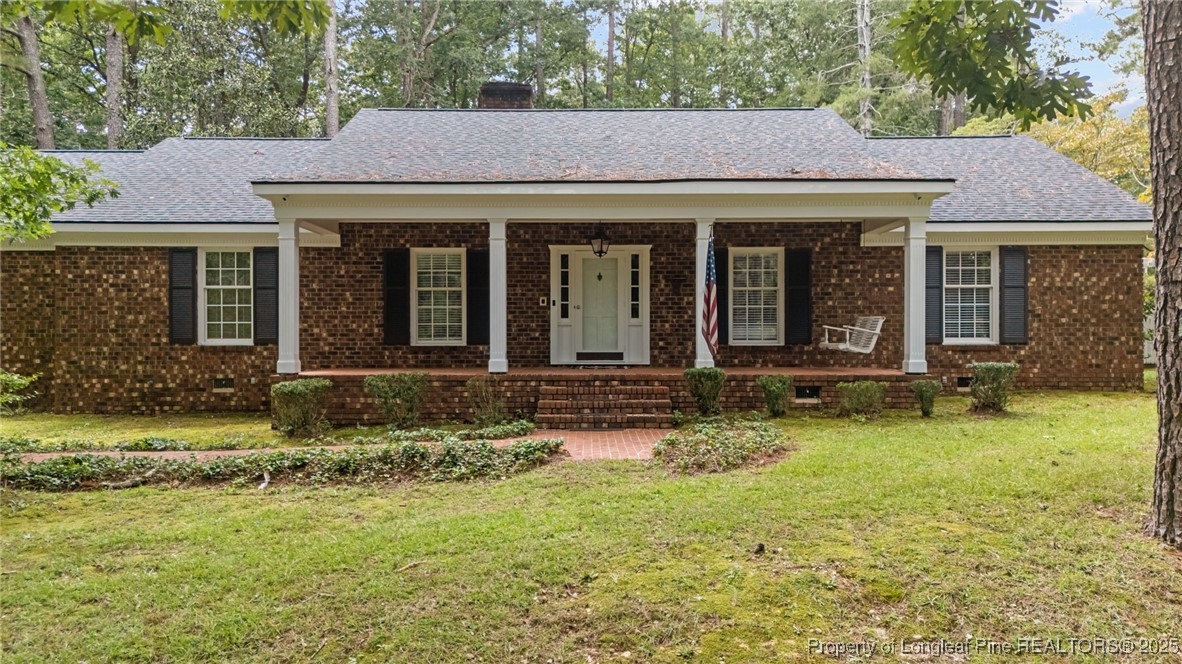 610 Maynard Lake Road Erwin, NC 28339 - Photo 2 of 49 a view of a house with garden and porch