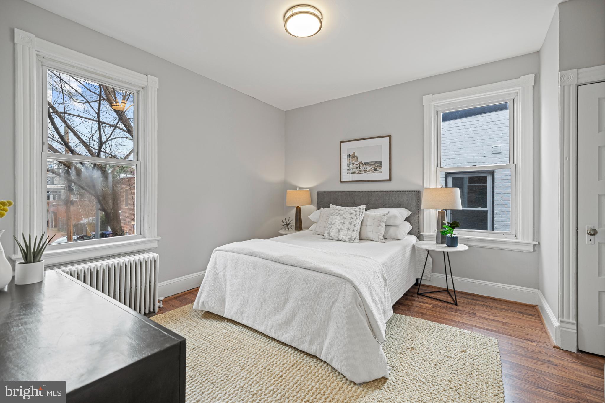 2219 Flagler Place Northwest Washington, DC 20001 - Photo 14 of 31 a bedroom with a bed and a window with outer view