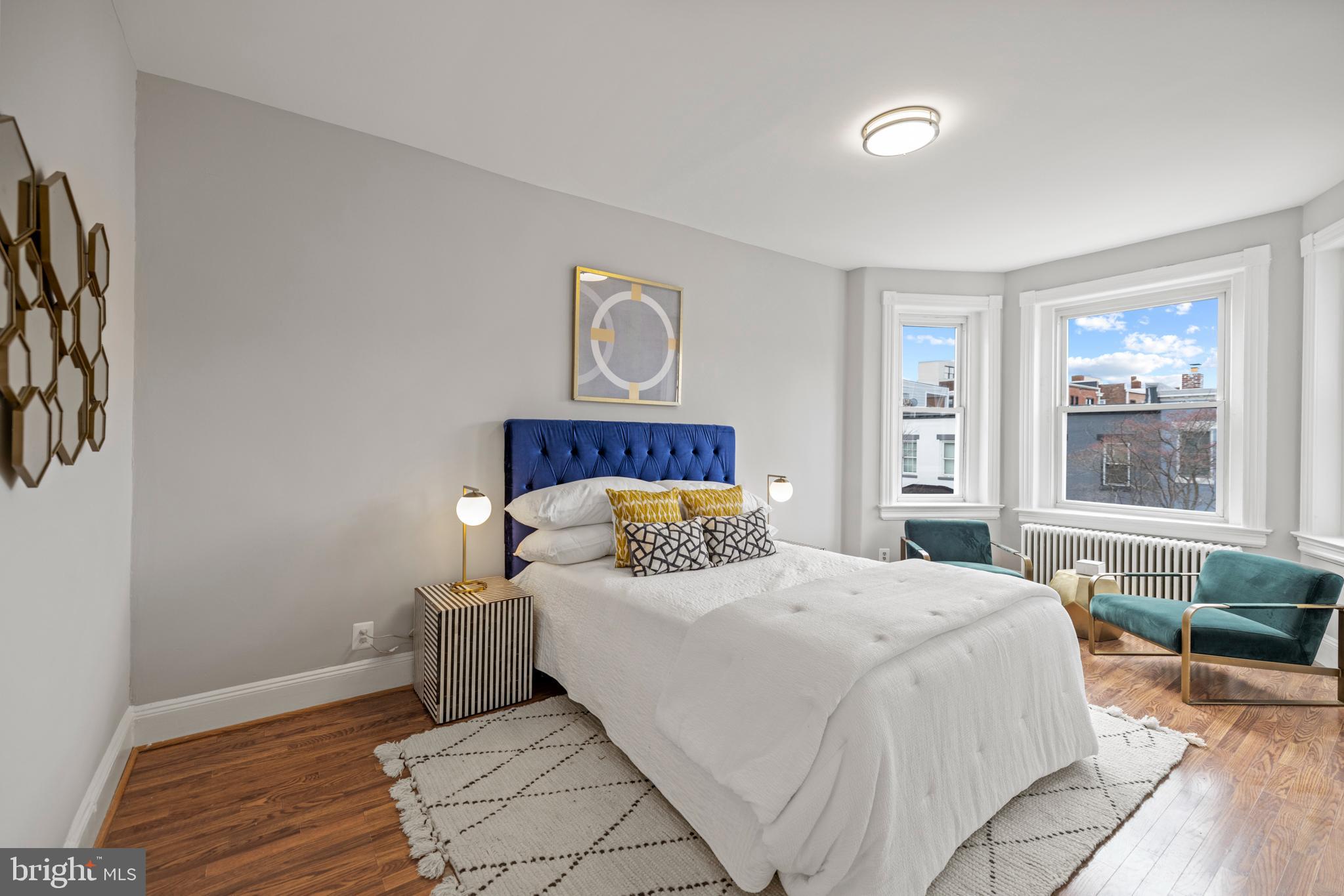 2219 Flagler Place Northwest Washington, DC 20001 - Photo 16 of 31 a bedroom with a bed and wooden floor