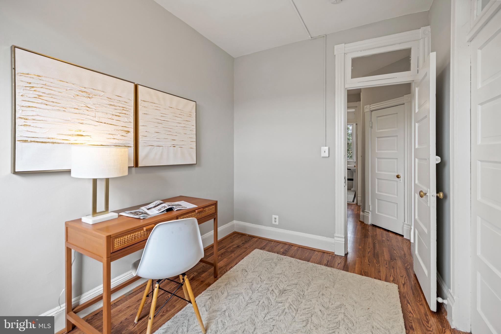 2219 Flagler Place Northwest Washington, DC 20001 - Photo 19 of 31 a bedroom with a bed and a table in it