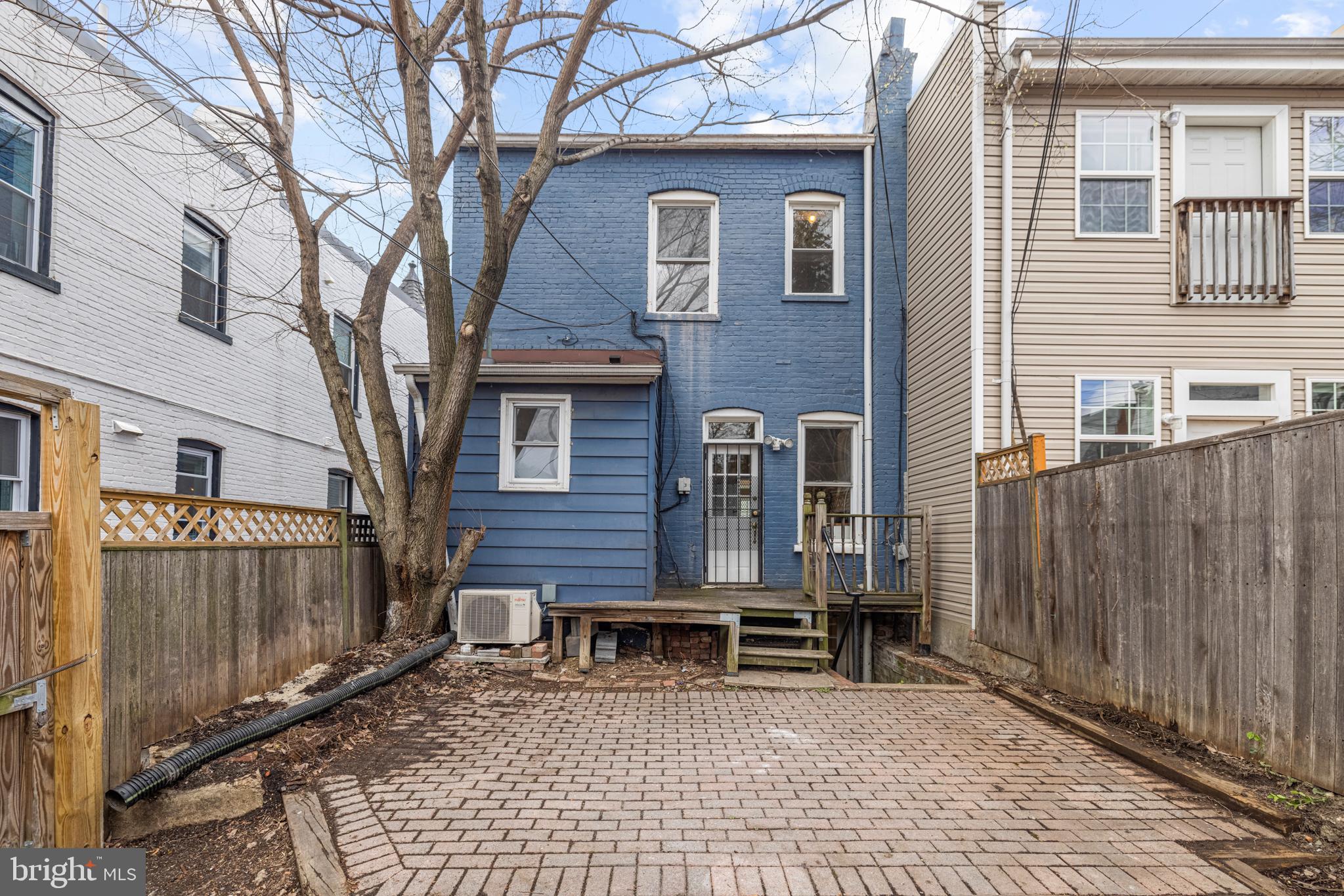 2219 Flagler Place Northwest Washington, DC 20001 - Photo 28 of 31 a view of a house with a bench and wooden fence