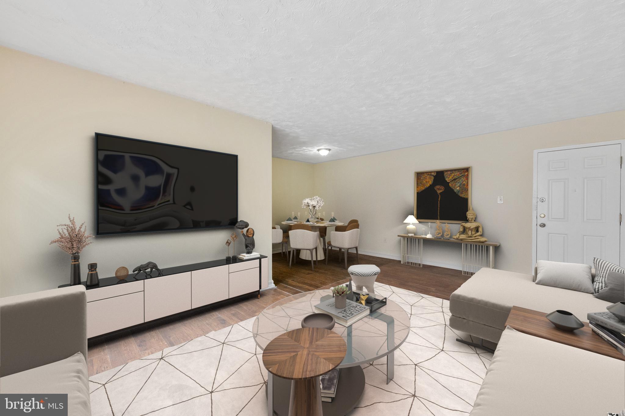 2400 Good Hope Road Southeast, Unit 103 Washington, DC 20020 - Photo 1 of 14 a living room with furniture and a flat screen tv
