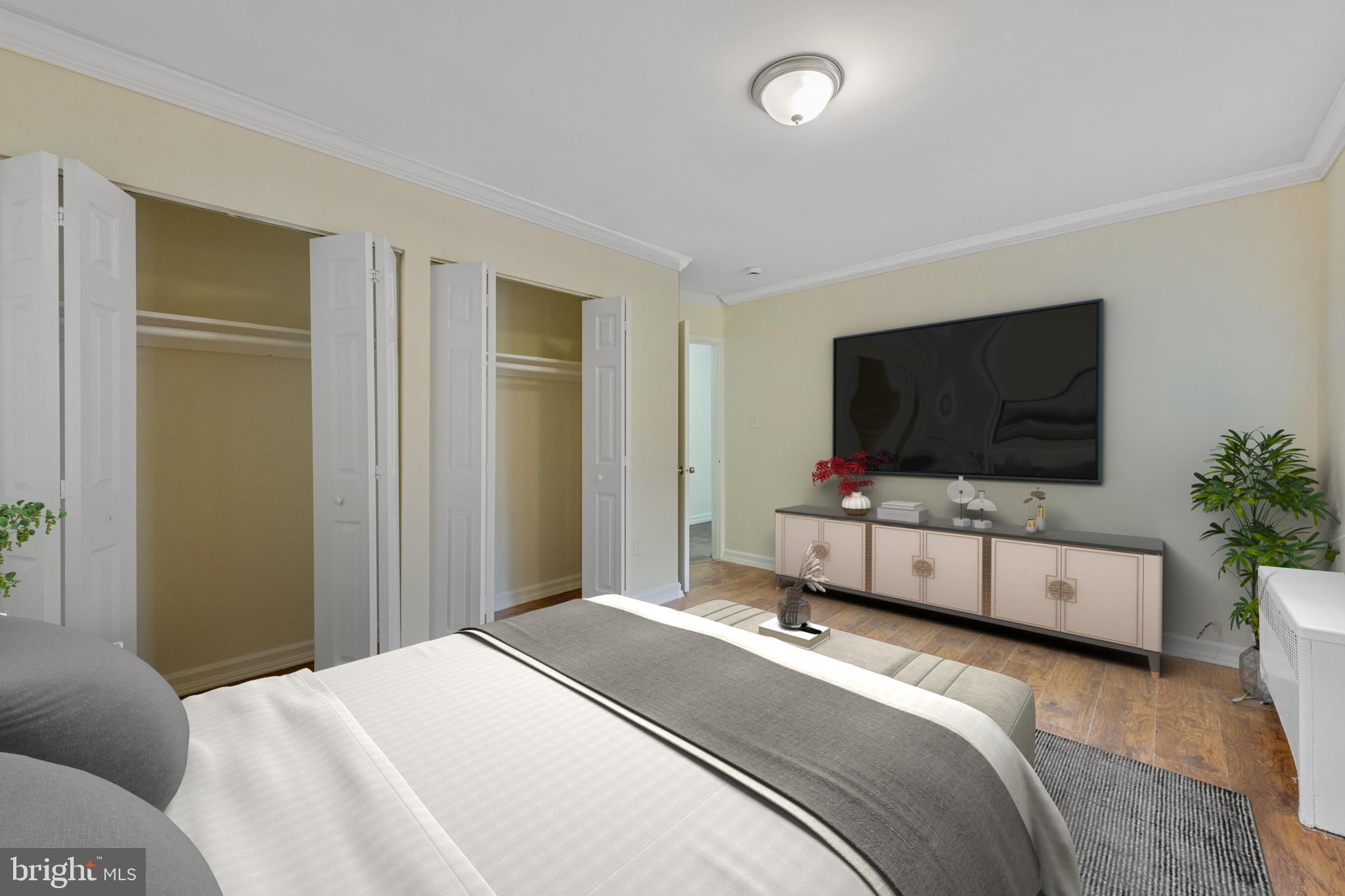2400 Good Hope Road Southeast, Unit 103 Washington, DC 20020 - Photo 11 of 14 a bedroom with furniture and flat screen tv